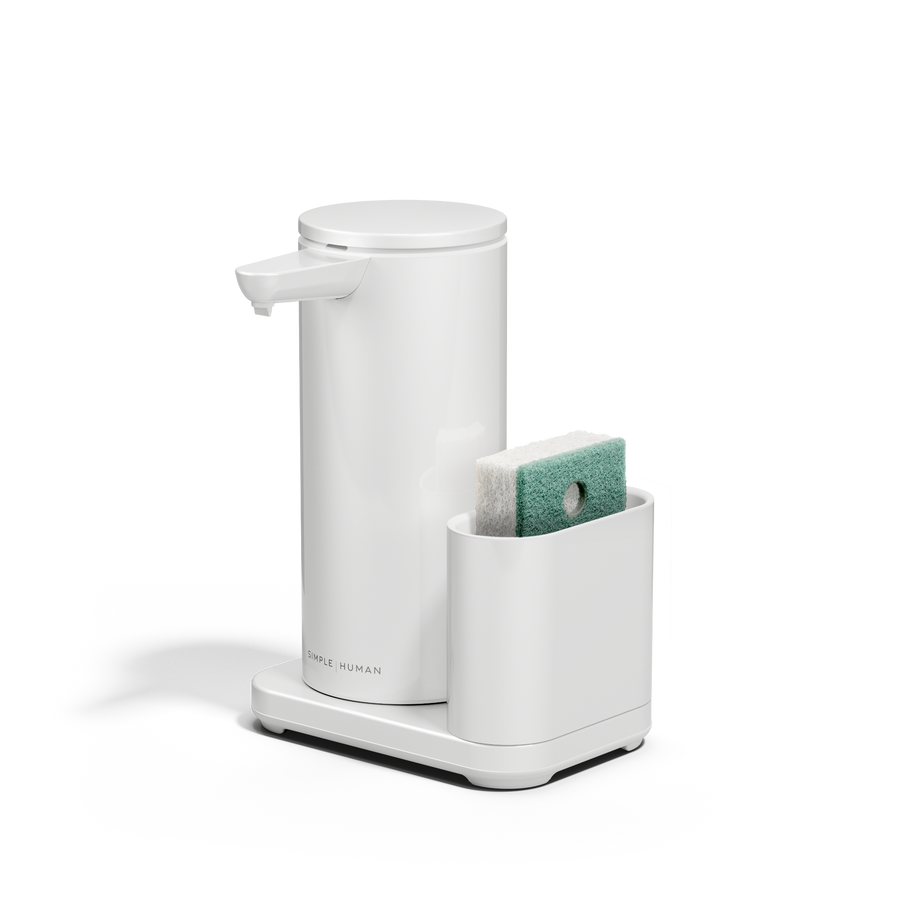 Angled view: Simplehuman White 14 oz or 414ml Sensor Pump + Caddy, touch-free rechargeable dispenser holding a sponge.
