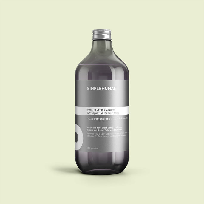 Simplehuman's Yuzu Lemongrass Multi-Surface Cleaner Refill Bottle on a colored background.