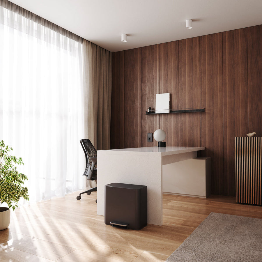 Lifestyle view of Simplehuman 15L Mini Recycler Step Can in Matte Black, compact for modern office use.