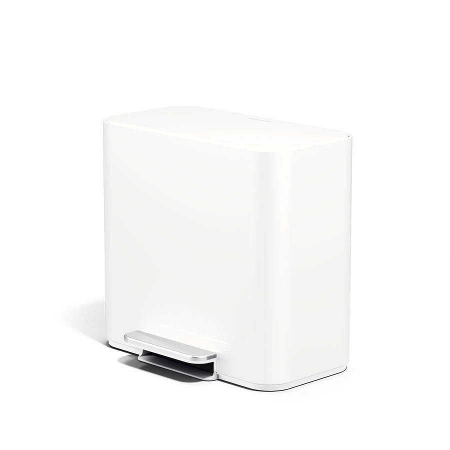 Lifestyle view of Simplehuman 15L Mini Recycler Step Can in White, angled view.