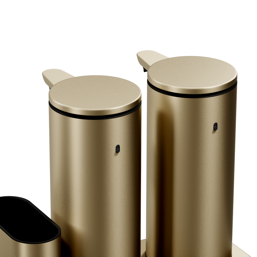Close-up showing the cylindrical bodies of the Simplehuman Brushed Brass Dual Sensor Pump 14 oz., rechargeable, hands-free.