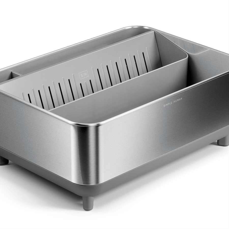 Close-up of Simplehuman Brushed stainless steel Bottle Dock with gray base and removable inner tray, detail view.