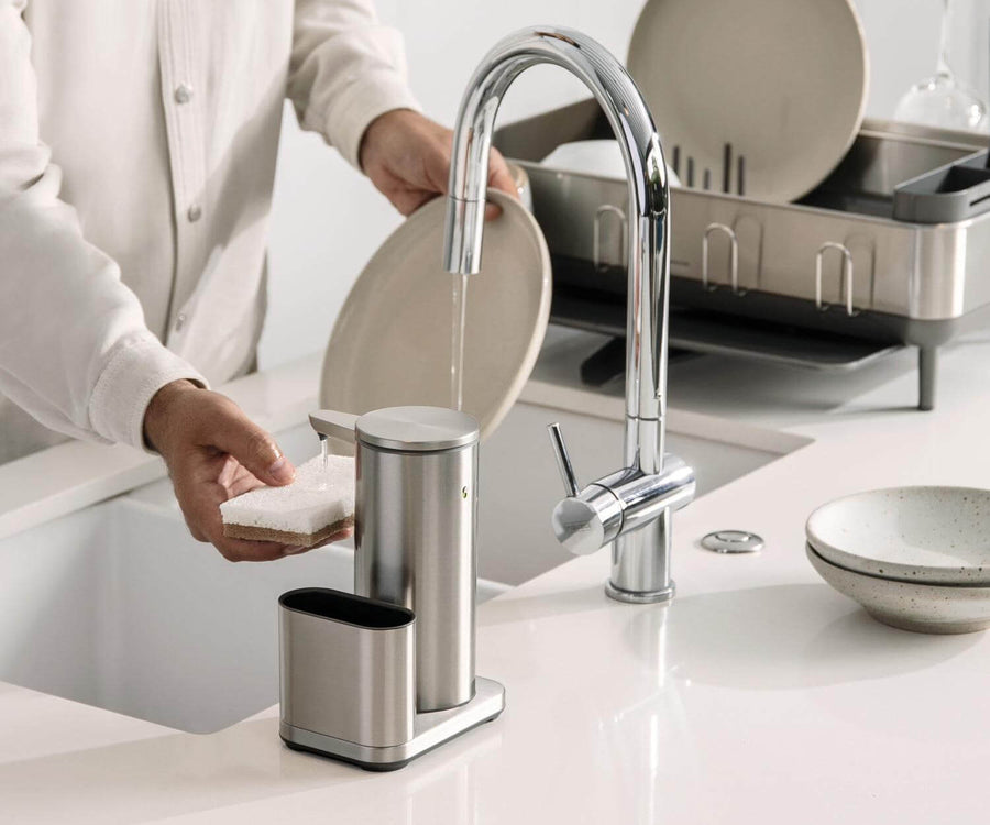Simplehuman's 14 oz. Sensor Pump with Caddy in Brushed on a clean, bright kitchen countertop setting.