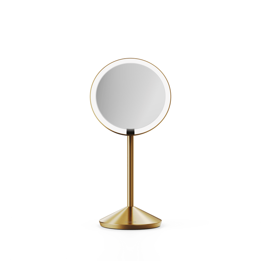 Simplehuman's Sensor Mirror Fold in Brass, front view.