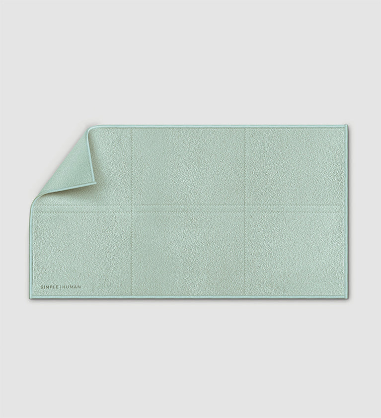 Sage Simplehuman Clean Cloth with folded corner and stitched sections on a light background.