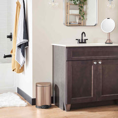 6L semi-round step can - rose gold finish - lifestyle in bathroom next to cabinet