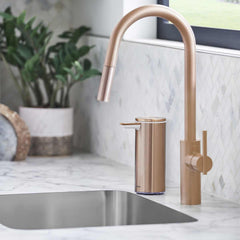 rechargeable liquid soap sensor pump - rose gold finish - lifestyle in bathroom